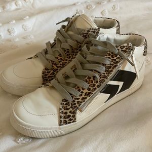 White/cheetah print high top Dolce Vita sneakers